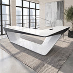 Chevron desk in a sunlit office with a city view
