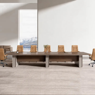 Chymé dark oak conference room table with tan leather chairs beside a window with mountain views