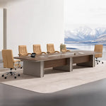 Chymé large conference table seating 12 to 14 in dark oak, with a tablet and tan chairs by a mountain view