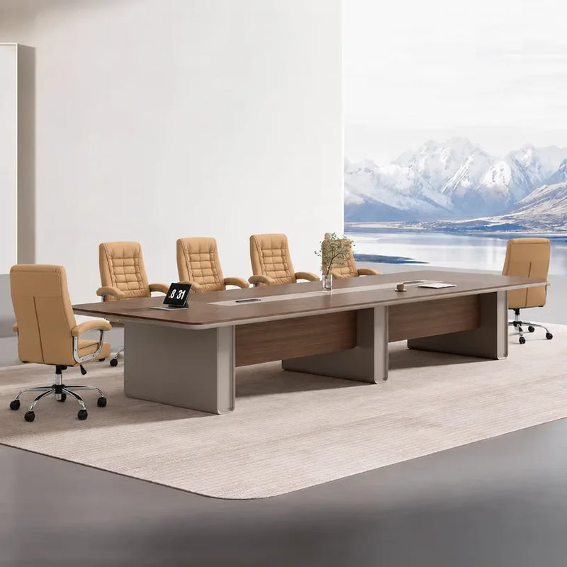 Chymé large conference table seating 12 to 14 in dark oak, with a tablet and tan chairs by a mountain view