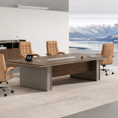 Chymé 8′ to 10′6″ (96 to 126-inch) meeting table in dark oak with a clock and two leather chairs