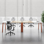 Comity white and beige conference table with orange-seat chairs in an office with window blinds