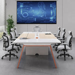 Comity collaborative meeting table seating 8 facing a wall display in a bright conference room