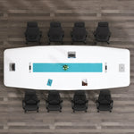 Top-down view of the Concord white conference table seating 8 in orange chairs, teal inlay and cable grommets