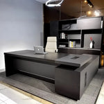 Photo of the Danton desk, left return, in a showroom with ring light