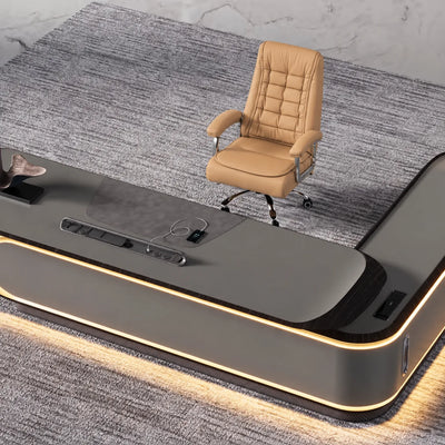 Echelon desk base with LED halo trim and cognac chair, close view