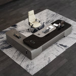 Elevon L-shaped desk from above with cream chair on marble-pattern rug