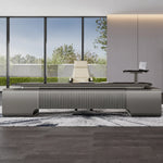 Elevon desk with fluted front band in a bright terrace office