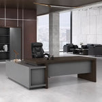 Elmore desk in macassar walnut in a dark marble CEO office