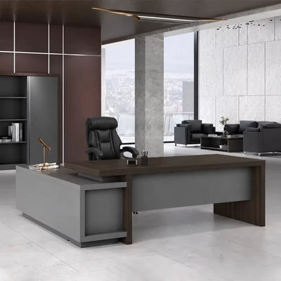 Elmore desk in macassar walnut in a dark marble CEO office