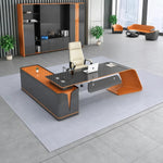 Euler manager desk, right return, in a gray office with orange accents