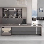 Eyer executive desk stretched along a bookcase wall