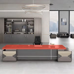 Eyer desk with red desktop over gray base in a showroom