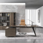 Flynn manager desk in walnut before a marble feature wall