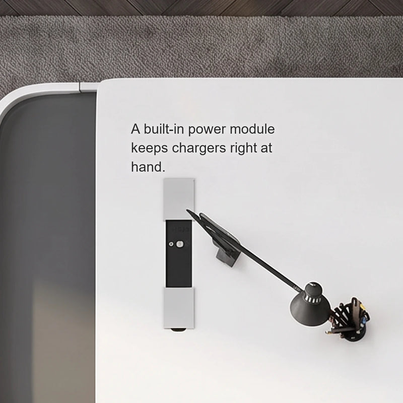Close-up of the Godel desk's built-in power module, seen from above