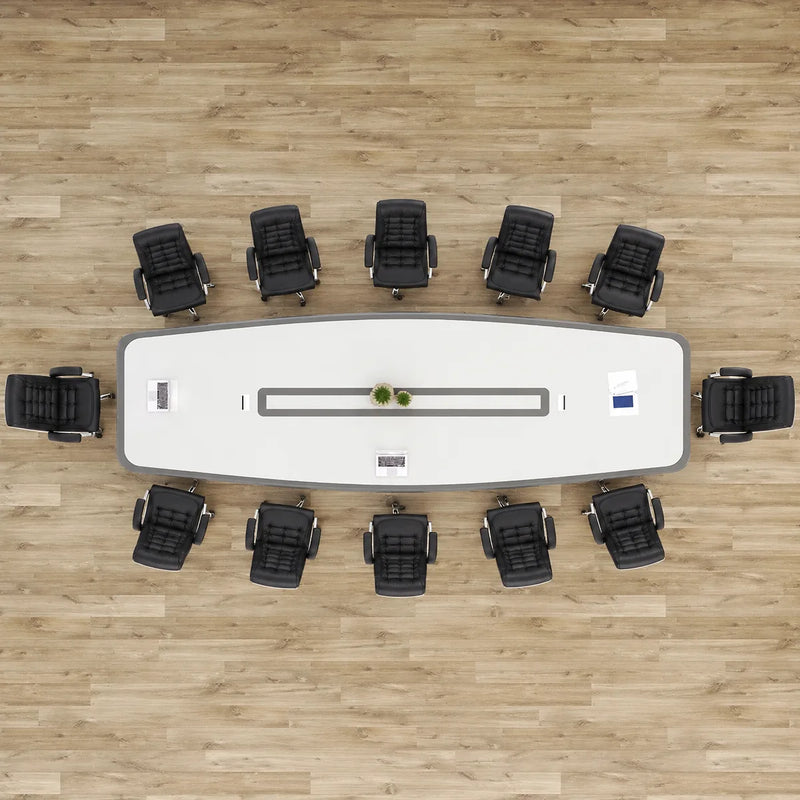 Top-down view of the Harmony white conference table seating 12 in black chairs, center cable channel visible