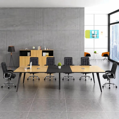 Harvard elm conference room table with black chairs against a concrete wall with city windows