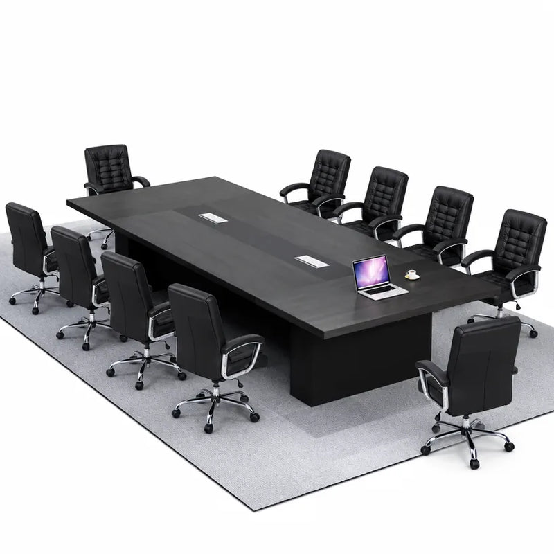 Hendley black conference table seating 8 in black leather chairs on a gray rug, angled view