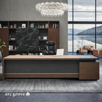 Hershey executive desk in Dark Oak with black accents in a modern office with a lake view