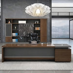 Dark Oak Hershey desk in a moody executive office with a sculptural white pendant light