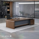 Hershey L-shaped executive desk in Dark Oak with brushed-silver trim in a gray-toned office