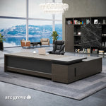 Dark Oak Hershey L-shaped executive desk in a waterfront office with guest seating