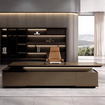 Hiley desk in a dark executive suite with curved ceiling light