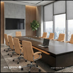 Hunter conference table with tan leather chairs in a slatted-wall meeting room with a wall-mounted TV