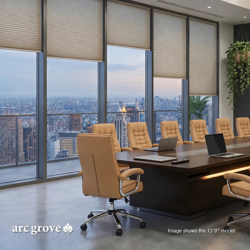 Hunter conference table with tan chairs and laptops beside floor-to-ceiling city windows