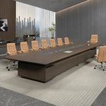 Hunter long conference table with tan leather chairs in a room with a slatted wood wall and stone floor