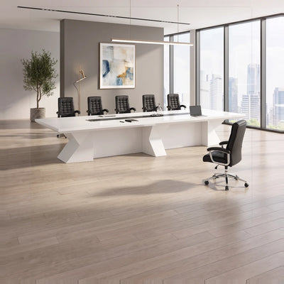 Kendrix white conference table with orange chairs, tablets on the center channel, tall windows and blue drapes