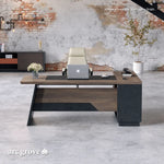 Linton desk in mahogany in an industrial loft, front view