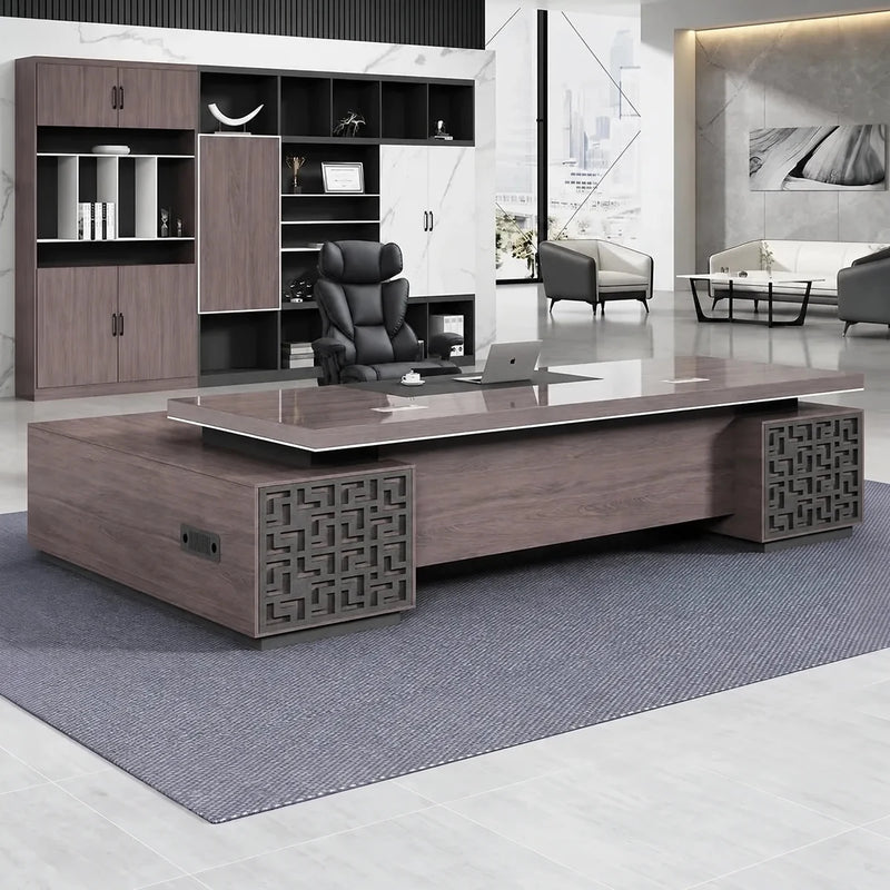 Magnus desk in a white-marble CEO office with lounge chairs