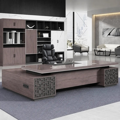 Magnus desk in a white-marble CEO office with lounge chairs