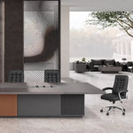Medley contemporary conference table with an orange leather pedestal panel, black chair and lake view