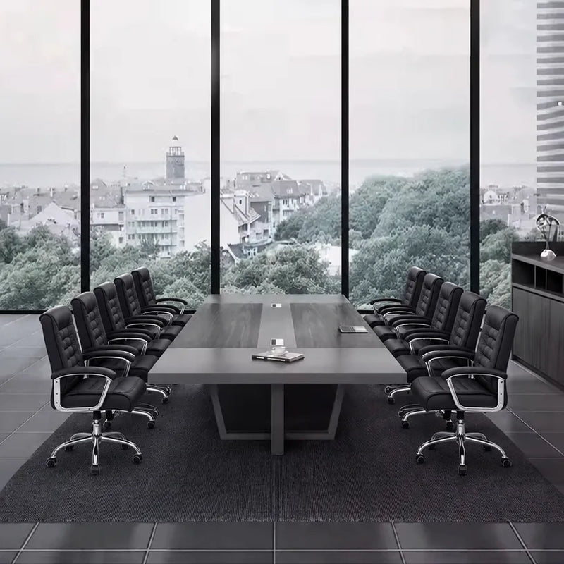Oakburn large conference table seating 12 in black chairs beside a panoramic window