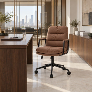 Nevern brown leather office chair beside a walnut desk in a corporate office overlooking the city
