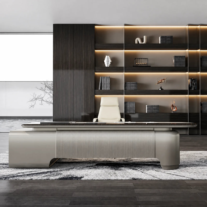 Orvane desk in an engineer's dark library office with cream chair