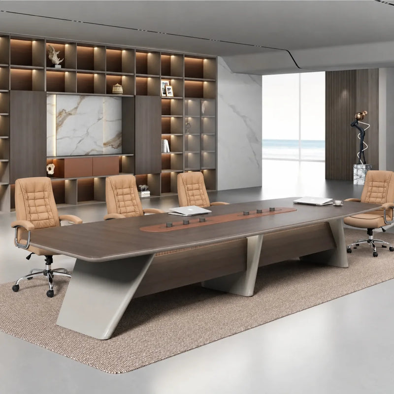 Parly oak boardroom table with tan chairs in front of a floor-to-ceiling display shelving wall