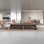 Parly conference table with tan chairs beneath a linear pendant against a stone feature wall