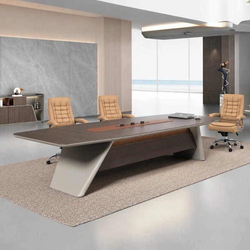 Parly executive conference table with beige leather chairs beside a stone wall, angled view