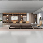 Parly oak conference table viewed straight on with a full-height shelving wall behind