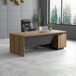 Pascal manager desk, left return, in a gray office with cactus