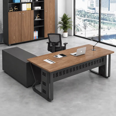 Patton manager desk with base return in a glass corner office