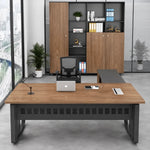 Patton desk in golden teak facing tall storage cabinets
