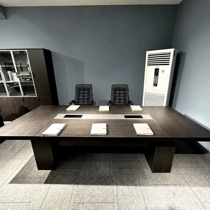Prime brown conference table set with notepads and leather chairs, photographed in a client office
