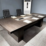 Prime professional meeting table with two leather chairs and a center grommet, client office photo