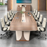 Rally brown oak conference table seating 10 in cream leather chairs, viewed from the head of the table