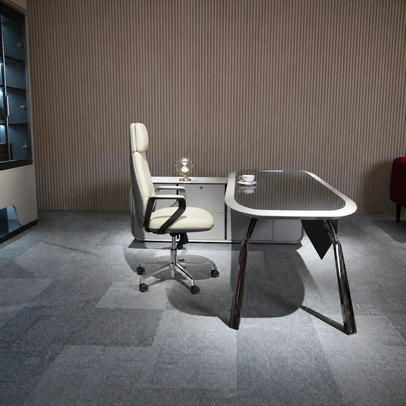 Selvor desk with orange chair in a carpeted studio office
