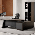 Slater desk, left return, dark shelving behind
